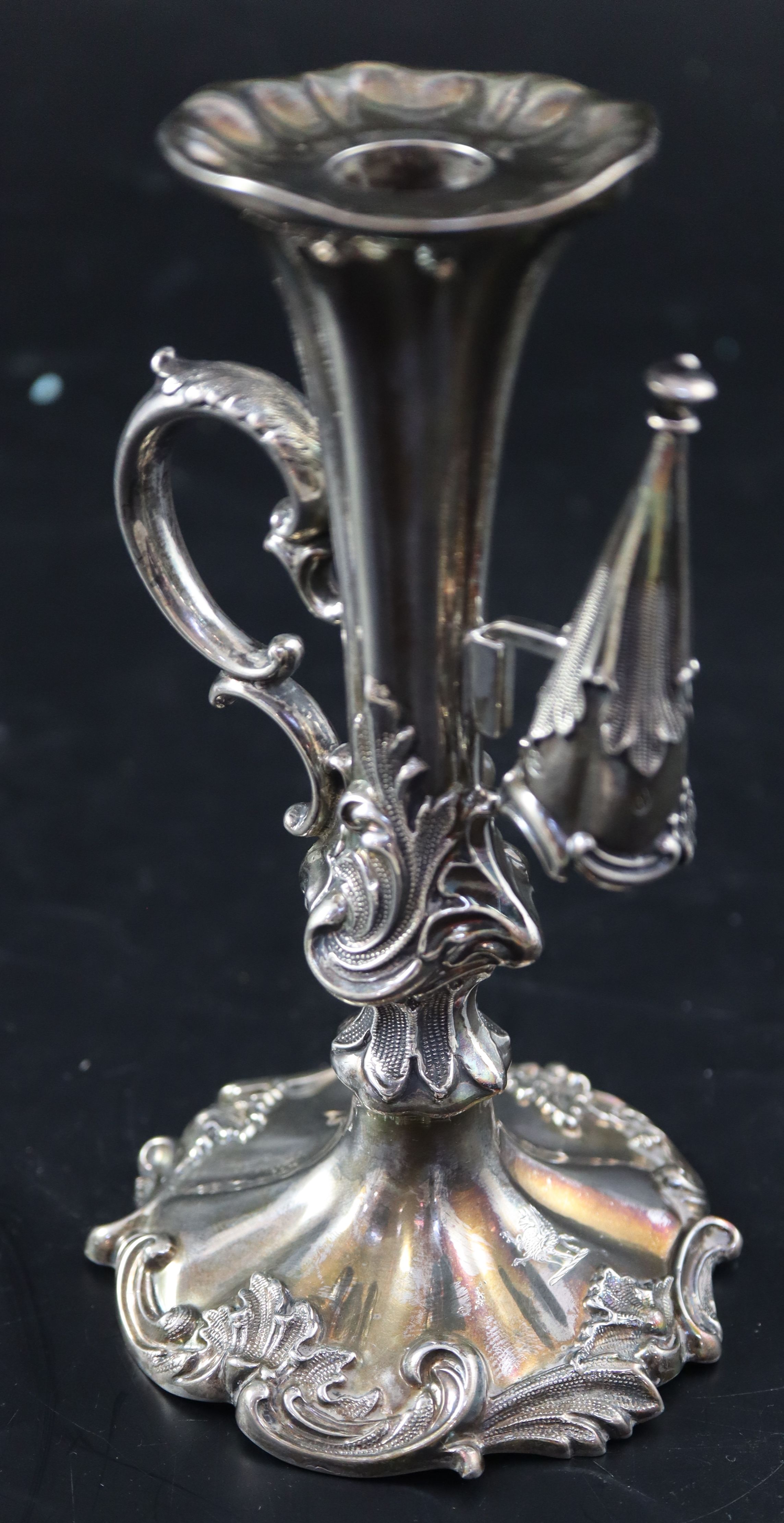 An ornate Victorian silver chamberstick, 14.3cm, gross 194 grams.